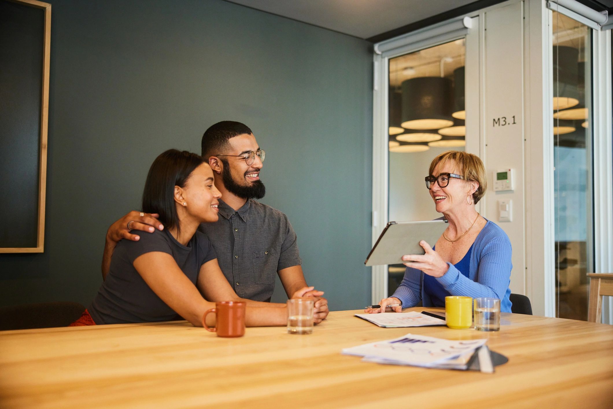 Advisor reviewing pricing information with a couple